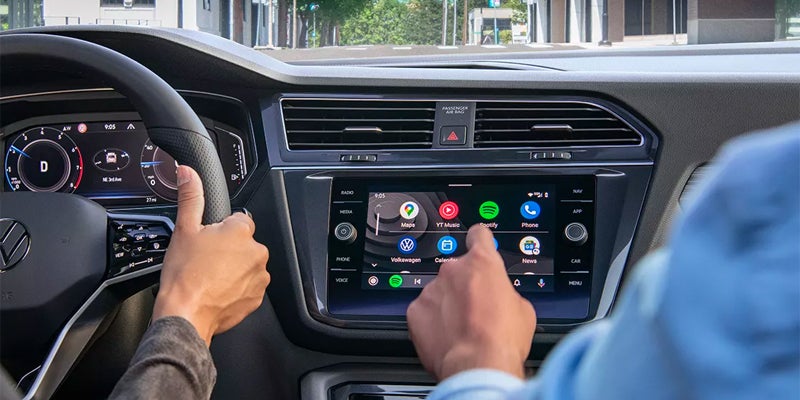 Vehicle dashboard with touchscreen infotainment system.
