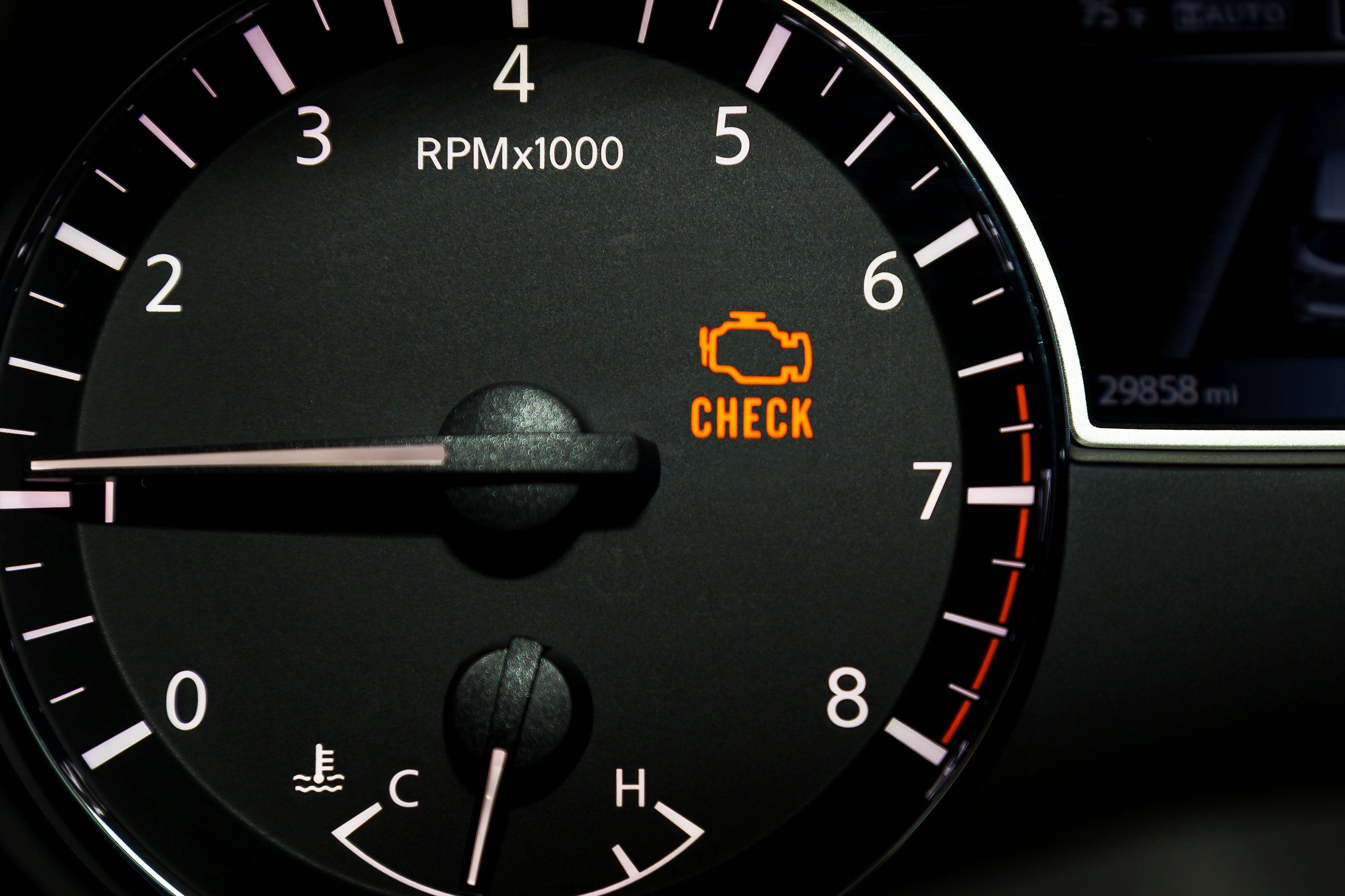 Check engine warning light on dashboard.